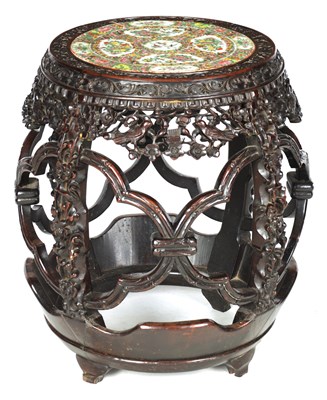 Lot 102 - A 19TH CENTURY CHINESE HARDWOOD GARDEN SEAT WITH CANTONESE PORCELAIN TOP