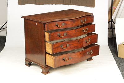 Lot 777 - A GEORGE III MAHOGANY SERPENTINE CHEST
