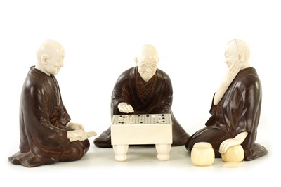 Lot 152 - A JAPANESE MEIJI PERIOD BRONZE AND IVORY FIGURAL GROUP OF THREE ELDERS PLAYING GO & GO BANG GAME
