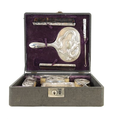 Lot 87 - AN EARLY CHINESE EXPORT CASED SILVER DRESSING TABLE SET