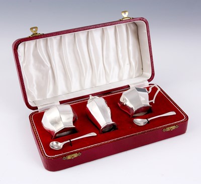 Lot 244 - A 20TH CENTURY THREE PIECE SILVER CONDIMENT...