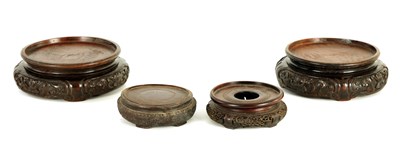 Lot 96 - A PAIR OF 18TH CENTURY CHINESE CARVED HARDWOOD VASE STANDS OF LARGE SIZE