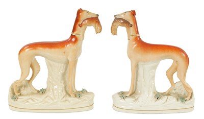 Lot 147 - A LARGE PAIR OF 19TH CENTURY STAFFORDSHIRE GREYHOUNDS