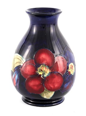 Lot 18 - A WALTER MOORCROFT SMALL BULBOUS FOOTED VASE