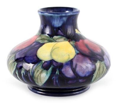 Lot 17 - A WALTER MOORCROFT FOOTED SQUAT BULBOUS CABINET VASE