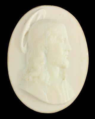 Lot 638 - AN EARLY CARVED OPAQUE GLASS OVAL PORTRAIT OF CHRIST