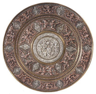 Lot 1390 - A 19TH CENTURY INDIAN TANJORE SILVER AND COPPER OVERLAID BRASS CHARGER