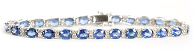 Lot 246 - A LADIES 18CT WHITE GOLD DIAMOND AND SAPPHIRE TENNIS BRACELET