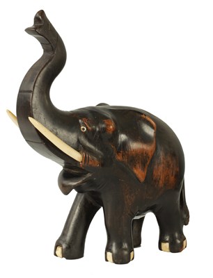 Lot 23 - A LATE 19TH CENTURY ANGLO INDIAN CARVED EBONY ELEPHANT