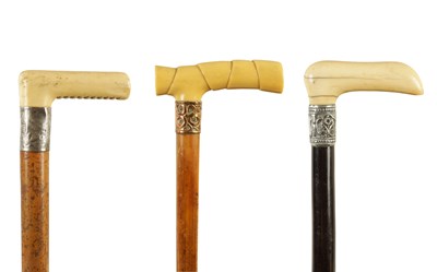 Lot 482 - A SELECTION OF THREE 19TH CENTURY IVORY HANDLED WALKING STICKS