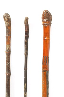 Lot 694 - A COLLECTION OF THREE MEIJI PERIOD JAPANESE BAMBOO WALKING CANES