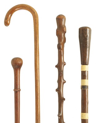Lot 34 - A COLLECTION OF FOUR WALKING STICKS INCLUDING A SWORD STICK