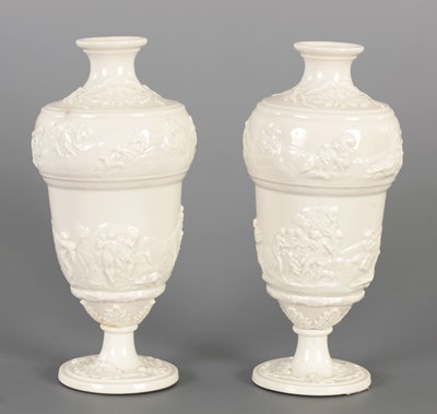 Lot 67 - A PAIR OF 19TH CENTURY CAPODIMONTE BLANC DE CHINE PORCELAIN VASES