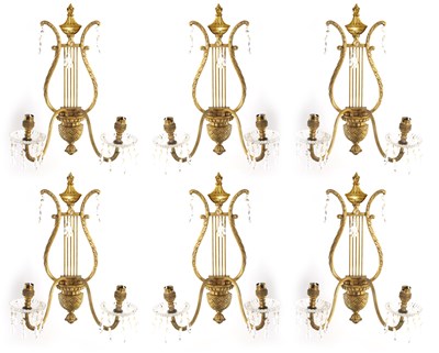Lot 543 - A SET OF SIX REGENCY STYLE BRASS CUT GLASS WALL LIGHTS