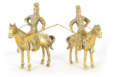 Lot 257 - A PAIR OF EARLY CHINESE BRASS SCULPTURES