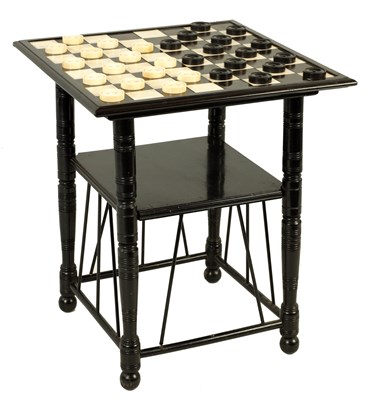 Lot 988 - AN IVORY AND EBONY GAMES TABLE IN THE MANNER OF A.E. GOODWIN