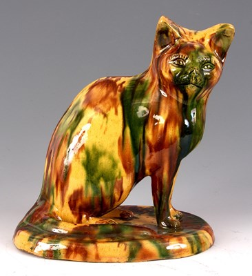 Lot 32 - A 19th CENTURY STAFFORDSHIRE SLIPWARE SEATED...