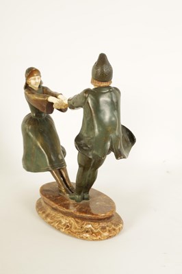Lot 493 - AN ART DECO FIGURAL BRONZE AND IVORY SCULPTURE