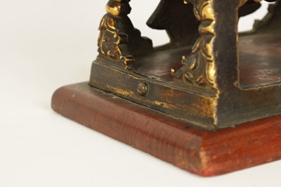 Lot 203 - AN EARLY GILT BRONZE TIBETAN BUDDHA DEPICTING AKSHOBHYA