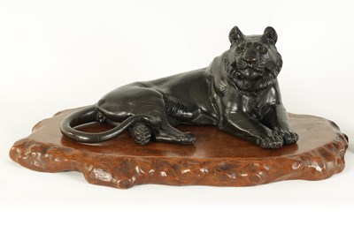 Lot 180 - A JAPANESE MEIJI PERIOD PATINATED BRONZE TIGER SCULPTURE