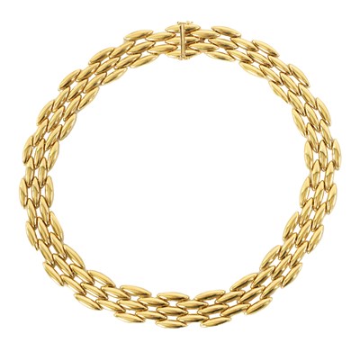 Lot 252 - CARTIER. A LADIES 18CT YELLOW GOLD GENTIANE CHOKER NECKLACE
