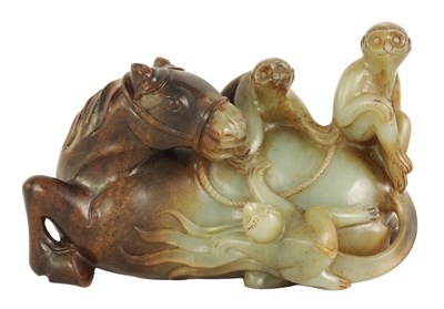 Lot 200 - AN EARLY CHINESE CARVED RUSSET JADE SCULPTURE OF A RECUMBENT HORSE AND THREE MONKEYS