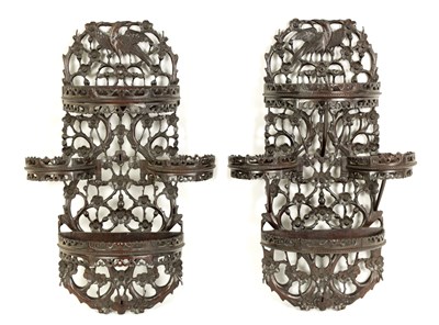 Lot 164 - A PAIR OF 19TH CENTURY CHINESE CARVED HARDWOOD HANGING SHELVES