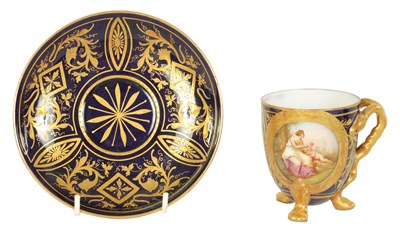 Lot 28 - A LATE 19TH CENTURY VIENNA STYLE RICHLY GILT AND ROYAL BLUE CABINET CUP AND SAUCER