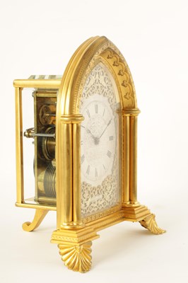 Lot 714 - ATTRIBUTED TO THOMAS COLE.  A FINE GILT BRASS GOTHIC REVIVAL TWIN FUSEE GILT BRASS STRUT CLOCK OF LARGE PROPORTIONS CIRCA 1860