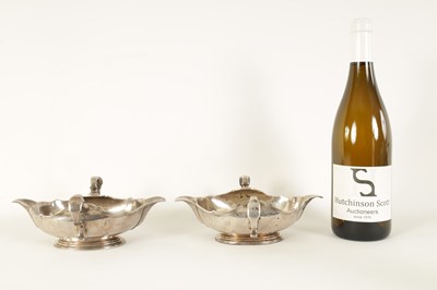 Lot 329 - AN IMPORTANT AND RARE PAIR OF GEORGE I CAST SILVER DOUBLE LIPPED SAUCE BOATS BY PIERRE PLATEL DATED 1717