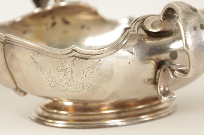 Lot 329 - AN IMPORTANT AND RARE PAIR OF GEORGE I CAST SILVER DOUBLE LIPPED SAUCE BOATS BY PIERRE PLATEL DATED 1717