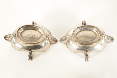 Lot 329 - AN IMPORTANT AND RARE PAIR OF GEORGE I CAST SILVER DOUBLE LIPPED SAUCE BOATS BY PIERRE PLATEL DATED 1717