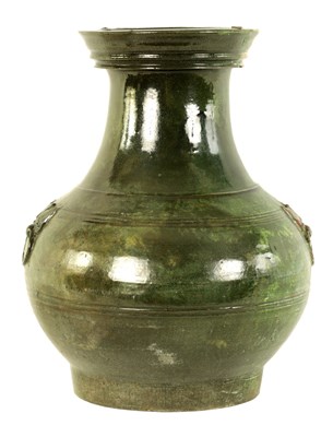 Lot 182 - A CHINESE HAN DYNASTY GREEN GLAZED POTTERY HU VASE