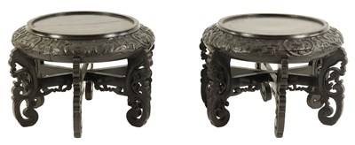 Lot 118 - A PAIR OF 19TH CENTURY CHINESE CARVED EBONISED HARDWOOD VASE STANDS