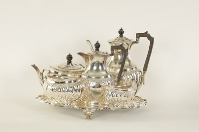 Lot 331 - AN EDWARD VII FIVE PIECE SILVER TEA SERVICE TOGETHER WITH A SILVER PLATED SALVER