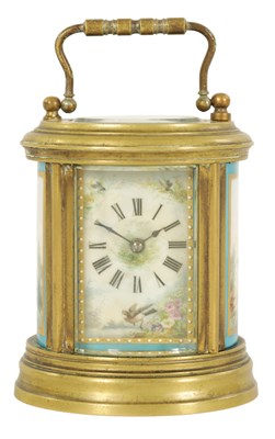 Lot 690 - A LATE 19TH CENTURY FRENCH OVAL MINIATURE PORCELAIN PANELLED CARRIAGE CLOCK