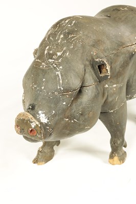 Lot 592 - AN EARLY 19TH CENTURY CARVED WOOD BUTCHERS SHOP ADVERTISING DISPLAY DEPICTING A POT-BELLIED PIG.