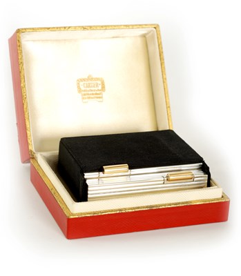 Lot 230 - CARTIER, PARIS  A MID 20TH CENTURY FRENCH SILVER AND GOLD MOUNTED LADIES POWDER COMPACT