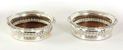 Lot 328 - A PAIR OF GEORGE IV OVERSIZED SILVER WINE COASTERS