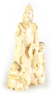 Lot 114 - A JAPANESE MEIJI PERIOD CARVED IVORY FIGURE GROUP