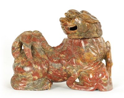 Lot 135 - AN EARLY CHINESE CARVED SOAPSTONE SCULPTURE OF A LIDDED FOO DOG