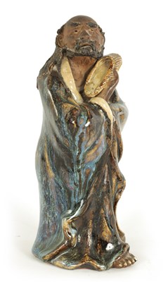 Lot 68 - A 19TH CENTURY CHINESE MAJOLICA SLIPWARE FIGURE