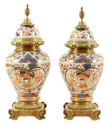 Lot 201 - A LARGE PAIR OF 18TH CENTURY JAPANESE IMARI ORMOLU MOUNTED LIDDED VASES