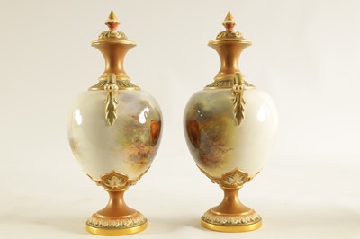 Lot 43 - HARRY STINTON. A FINE PAIR OF ROYAL WORCESTER OVOID PEDESTAL CABINET VASES AND COVERS