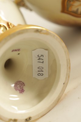 Lot 43 - HARRY STINTON. A FINE PAIR OF ROYAL WORCESTER OVOID PEDESTAL CABINET VASES AND COVERS
