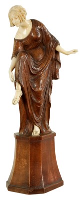 Lot 787 - LEONIE BOEHM-HENNES. AN ART NOUVEAU MIXED MEDIA  WALNUT AND IVORY CARVED SCULPTURE OF A YOUNG LADY