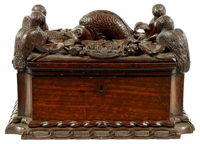Lot 567 - A UNUSUAL GEORGE III CARVED WALNUT CASKET