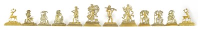 Lot 400 - A GROUP OF SIX PAIRS OF 19TH CENTURY CAST BRASS HEARTH ORNAMENTS