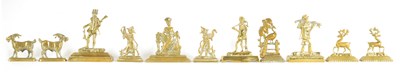 Lot 399 - A GROUP OF FOUR 19TH CENTURY LARGE FIGURAL CAST BRASS HEARTH ORNAMENTS