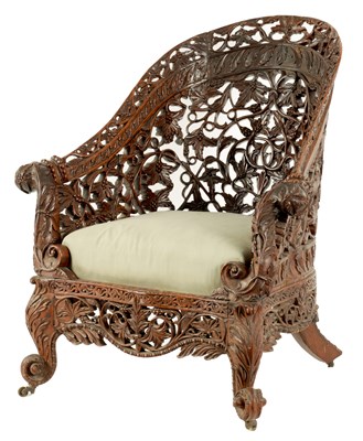 Lot 208 - A 19TH CENTURY ANGLO INDIAN CARVED HARDWOOD LIBRARY CHAIR